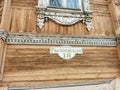 Street sign with house number on the wall of old wooden house in Kineshma, Russian town on Volga river. Royalty Free Stock Photo