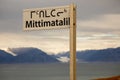 Street sign in Inuit language, Pond Inlet, Baffin Island, Nunavut, Canada