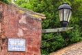 Street sign and lamp in Colonia del Sacramento, Uruguay Royalty Free Stock Photo