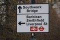 A street sign in London, UK directs traffic towards different areas of the city.