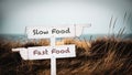 Street Sign Slow versus Fast Food Royalty Free Stock Photo