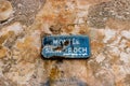 Street sign on the stone walls of Bonifacio, Corsica