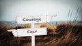 Street Sign to Courage versus Fear Royalty Free Stock Photo