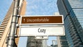 Street Sign to Cozy versus Uncomfortable Royalty Free Stock Photo