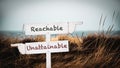 Street Sign to Reachable versus Unattainable Royalty Free Stock Photo