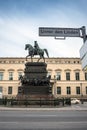 Street sign Unter den Linden and statue of Frederick the Great