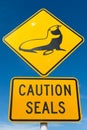 Street sign warning about wild seals in the area.