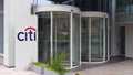 Street signage board with Citigroup logo. Modern office building. Editorial 4K 3D rendering