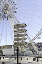Street signs and Ferris Wheel in the Old Port area of Marseille, France. Royalty Free Stock Photo
