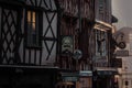 Street signs of the pubs and cafes at the facade of the buildings in Bourges, France