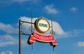 Street signs with text `reopening, covidsafe` on metal pole. Blue sky background. Charity. Covid-19 pandemic concept, copy space