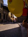 Elmoas Street with ancient buildings and colored balloons