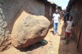 A street in the slums of Nairobi with a stone sticking out of the wall is one of the poorest places in Africa