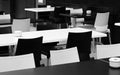 Street small cafe with bw tables and chairs. Royalty Free Stock Photo