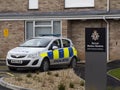 STREET, SOMERSET, ENGLAND - MARCH 9 2020: Police car parked outside a police station. Visible logo mission statement