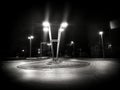 A street square lit up with lighting poles Royalty Free Stock Photo