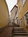 Street with stairs and cbblestone to medieval defense tower in Tallinn