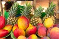 Street stall with pineapples and mangoes Royalty Free Stock Photo