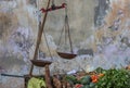 Street stall with vegetables and vintage scales