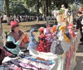 Street stand saleswoman of souvenir dolls