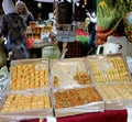 A street stand of small and delicious muslim pistachio desserts.