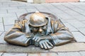 Street statue of Man at Work in Bratislava called Cumil, Slovakia Royalty Free Stock Photo