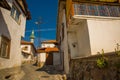 Street with stray houses and minaret of the mosque. Ankara, Turkey