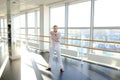 Street style dancer making hand movements near big window. Royalty Free Stock Photo