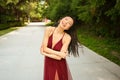 Street style outdoor portrait of Beautiful young Chinese Asian happy smiling woman walking outside sunny summer day Royalty Free Stock Photo