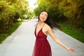 Street style outdoor portrait of Beautiful young Chinese Asian happy smiling woman walking outside sunny summer day Royalty Free Stock Photo