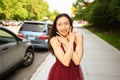 Street style outdoor portrait of Beautiful young Chinese Asian happy smiling woman walking outside sunny summer day Royalty Free Stock Photo