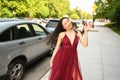 Street style outdoor portrait of Beautiful young Chinese Asian happy smiling woman walking outside sunny summer day Royalty Free Stock Photo