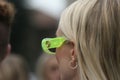Street style outfit, detail of a girl wearing neon yellow sunglasses from Gucci, in Milan,
