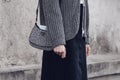 Street style, woman wearing Prada: silver Cleo handbag in detail