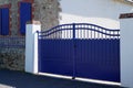 Street suburb home steel blue metal retro house gate garden access door Royalty Free Stock Photo