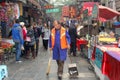 Street sweeper at work at the Beiyuanmen Muslim Market in Xian, China Royalty Free Stock Photo