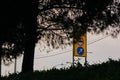 Street tabella and traffic sign near the road by taken photo low angle