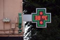 Street thermometer of a pharmacy at 38 degrees celsius