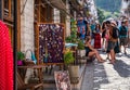 Street with tourists and souvenir shops in Gjirokaster, Albania