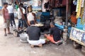 Street trader sells fast food for hungry people on the busy street in Kolkata