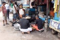 Street trader sells fast food for hungry people on the busy street in Kolkata