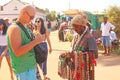 Street trading. Bald Tourist European buys beads or jewelry from an Indian seller. The seller on the street sells his goods.