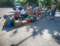street trading poor retired grandmother in hot sun