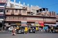 Street with traditional rickshaw taxi cabs