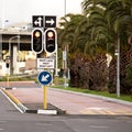 Street, traffic light and sign with arrow in city with mistake for humor, joke and comic grammar for direction. Asphalt Royalty Free Stock Photo