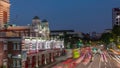 Street traffic near the fire station of Singapore day to night aerial timelapse.