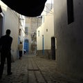 Street of Tunis with two men walking