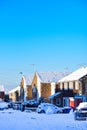 Street with two-storey houses, all in the snow. Royalty Free Stock Photo