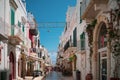 Street of a typical Italian village on a sunny day.