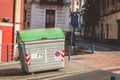 In the street a typical public garbage container in spain